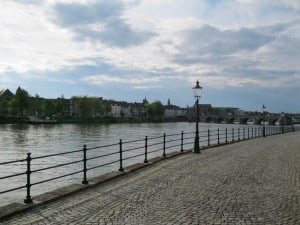 Cobblestone streets by the River Maas (which actually starts in France and also runs through Belgium).