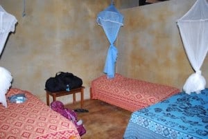 Our lodgings are cozy - 3 cots with bright sheets covered with mosquito netting. 