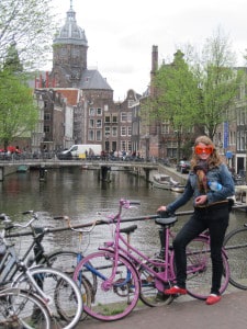 Christine posing with some Ajax (Dutch soccer team) orange sunglasses and her pink bike in Amsterdam. Eat your heart out, Lady Gaga!