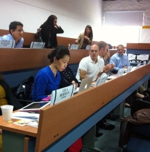 First morning of class. DJ looks to Li for an answer to how many banking crises have occurred in the past century —- 13.