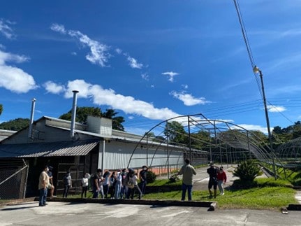 SICAFE Tour (El Salvador) learning about the bean-to-cup process for coffee. March 2020.