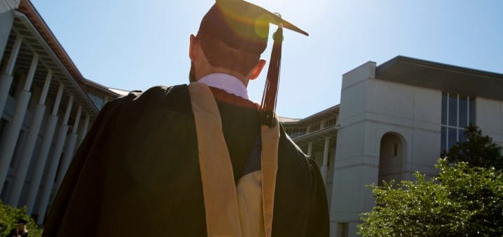 Emory graduate walking