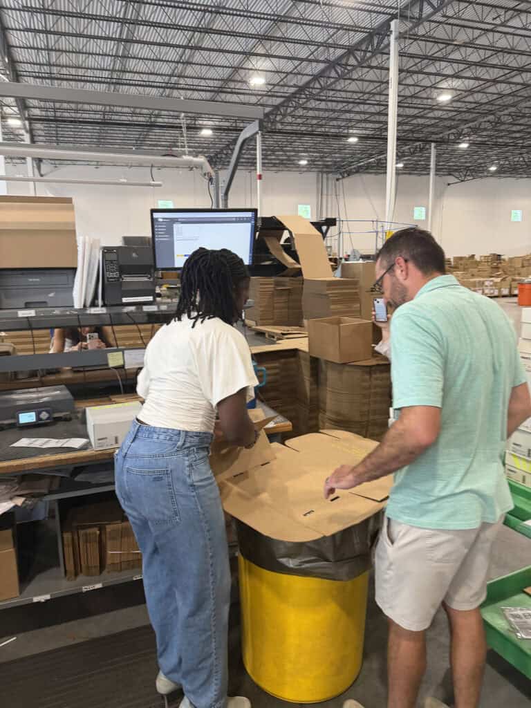 Packaging Sneex Customer Orders with Warehouse owner, Jeff